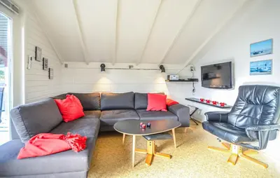 a living room with a couch and two chairs at Two-Bedroom Holiday Home In Thisted in Thisted