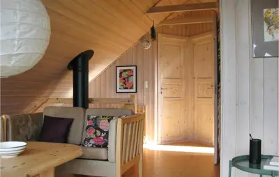 a room with a couch and a table in a house at Three-Bedroom Holiday Home In Thisted in Thisted