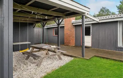 a patio with a picnic table and a pavilion at Holiday Home Klemsvej in Thisted