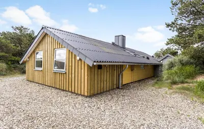 a yellow house with a metal roof at Holiday Home Tranebærvej Thisted Iv in Nørre Vorupør