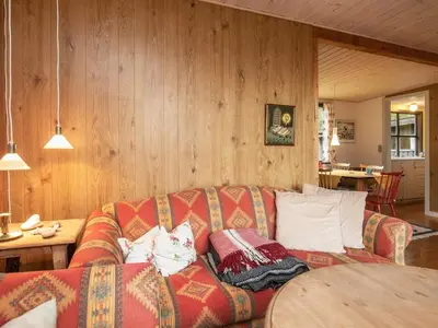 a living room with a couch and a table at Charming Cottage near Beach - By Traum Ferienwohnungen in Fjerritslev