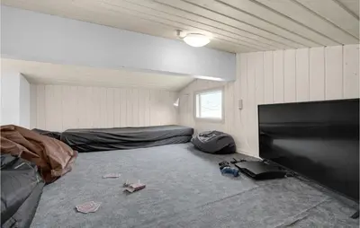 a room with a flat screen tv in a room at Stunning Home In Vestervig With Wifi in Vestervig