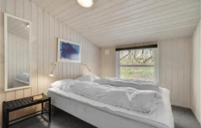 a bedroom with a large bed with white sheets at Stunning Home In Vestervig With Wifi in Vestervig