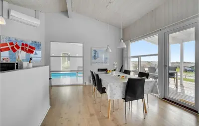 a dining room with a table and chairs at Stunning Home In Vestervig With Wifi in Vestervig