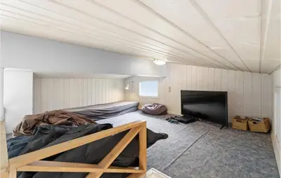 a room with a bed and a flat screen tv at Stunning Home In Vestervig With Wifi in Vestervig