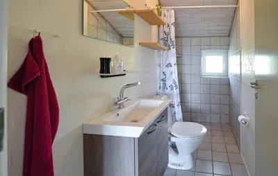 a bathroom with a sink and a toilet at Awesome Home In Vestervig With Kitchen in Vestervig