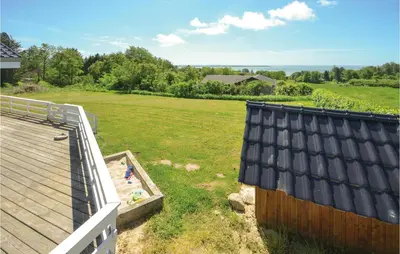 an aerial view of a house with a roof at Awesome Home In Spøttrup With Sauna in Spottrup