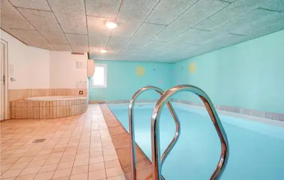 a large bathroom with a tub and a shower at Stunning Home In Spøttrup With Sauna in Spottrup