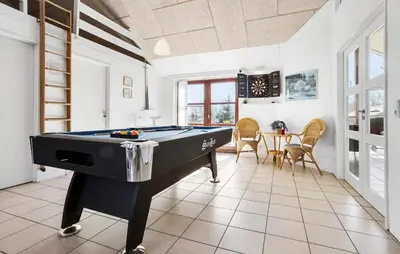 a living room with a pool table in it at Amazing Home In Vinderup With Sauna in Vinderup