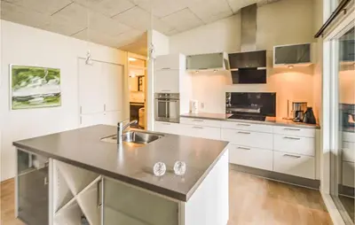 a kitchen with a sink and a counter top at Holiday Home Følvigvej Roslev I in Roslev