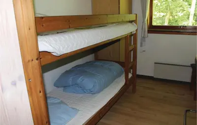 a couple of bunk beds in a room at Holiday Home Kraghøjvej Nykøbing M Ix in Hesselbjerg