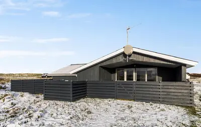 a house on top of a hill with snow at Gorgeous Home In Thisted With Sauna in Thisted