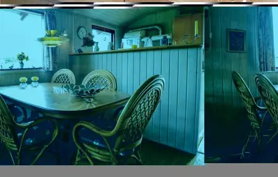 a dining room with a table and chairs at Holiday Home Hellesvej Løgstør Xi in Løgstør