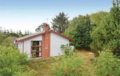 a small house in the middle of a field at Holiday Home Hellesvej Løgstør Xi in Løgstør