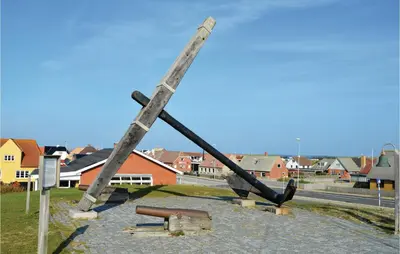 a large piece of equipment sitting on the side of a street at Holiday Home Hjelmevej Ulfborg Vi in Ulfborg