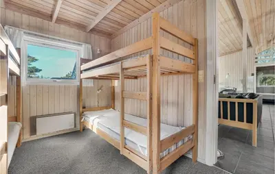 a bedroom with two bunk beds in a room at 4 Bedroom Gorgeous Home In Fjerritslev in Fjerritslev