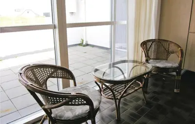 three chairs and a glass table in a room with a window at Gorgeous Home In Frøstrup With Wifi in Frøstrup