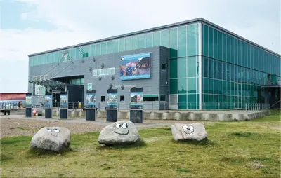 a building with three large rocks in front of it at Holiday Home Strandvejen Harboøre X in Harboør