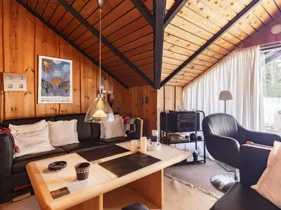 a living room with a couch and a table at 8 person holiday home in Løgstør-By Traum in Løgstør