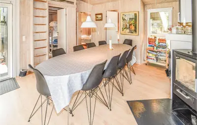 a dining room with a table and chairs at Stunning Home In Saltum With Sauna in Saltum