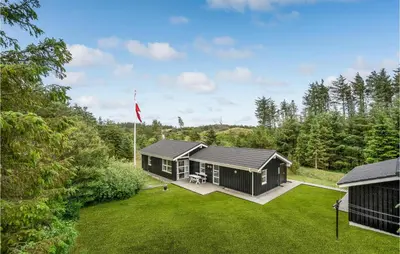 an image of a house with a yard at Holiday Home Stellavej Løkken Denm in Løkken