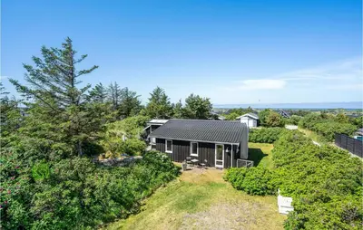 an aerial view of a house with a garden at Holiday Home Lyngvej Blokhus Iv in Blokhus