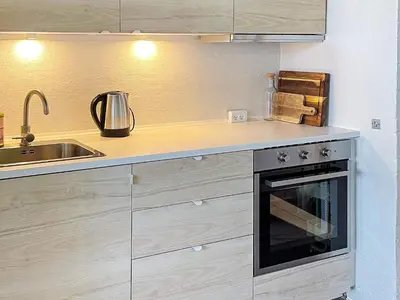 a kitchen with a stove and a sink at 6 person holiday home in Brovst-By Traum in Brovst