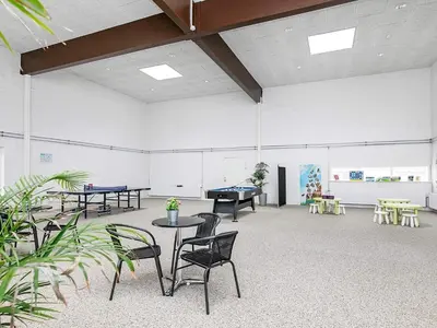 a large room with ping pong tables and chairs at 6 person holiday home in Brovst-By Traum in Brovst