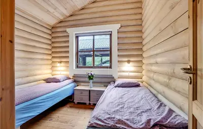 two beds in a room with a window at Holiday Home Ramshule Farsø Xii in Farsø