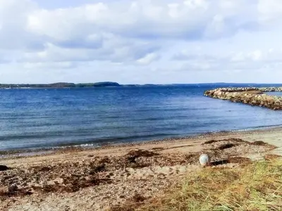 a view of the ocean from a rocky beach at 6 person holiday home in Farsø-By Traum in Farsø