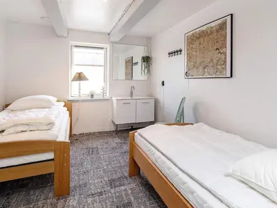 a bedroom with two beds and a window at 12 person holiday home in Thisted-By Traum in Thisted
