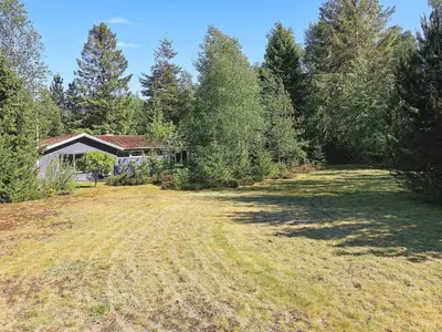 an empty field in front of a house at 6 person holiday home in Højslev-By Traum in Højslev
