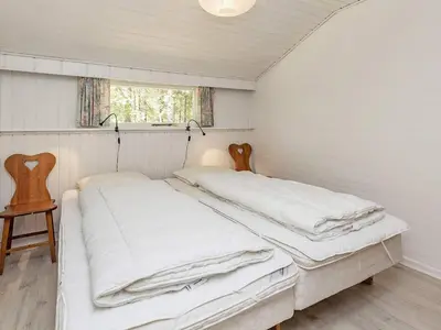 two beds in a small room with a window at 6 person holiday home in Højslev-By Traum in Højslev