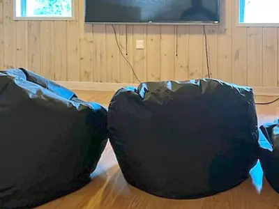 two black bean bags sitting on the floor in front of a television at 8 person holiday home in Højslev-By Traum in Højslev