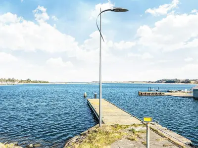 a street light on a dock on a body of water at 20 person holiday home in Højslev-By Traum in Højslev