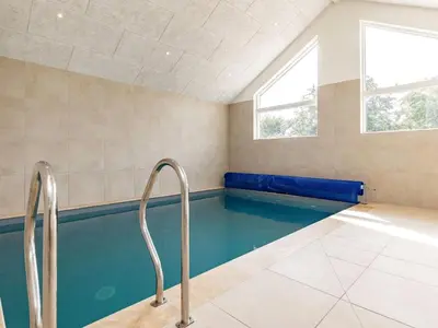a swimming pool with two metal rails in a room at 20 person holiday home in Højslev-By Traum in Højslev
