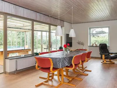 a dining room with a table and chairs at 8 person holiday home in Struer-By Traum in Struer