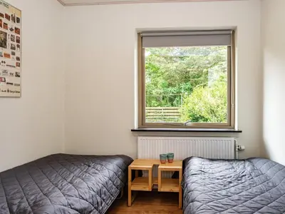 a bedroom with a bed and a window at 8 person holiday home in Struer-By Traum in Struer