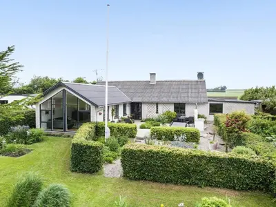 a house with a garden in front of it at 8 person holiday home in Vesløs-By Traum in Vesløs