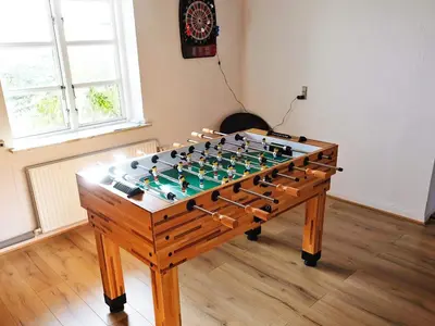 a foosball table in a room with a chessboard at 8 person holiday home in Vesløs-By Traum in Vesløs