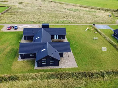 an overhead view of a house with solar panels on it at Luxury Retreat with Pool - By Traum Ferienwohnungen in Harboør