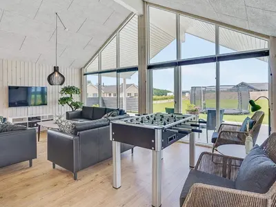 a living room with a ping pong table at Luxury Retreat by Limfjorden - By Traum Ferienwohnungen in Spottrup