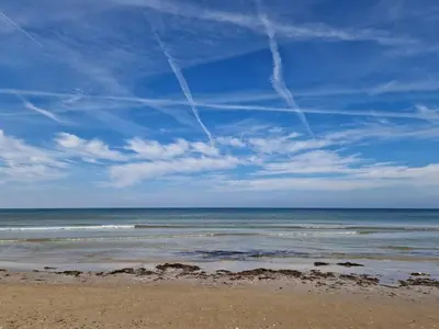 a view of the ocean from a sandy beach at 8 person holiday home in Blokhus-By Traum in Blokhus