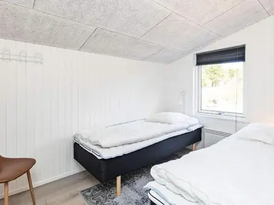 a bedroom with two beds and a window at 10 person holiday home in Fjerritslev-By Traum in Fjerritslev