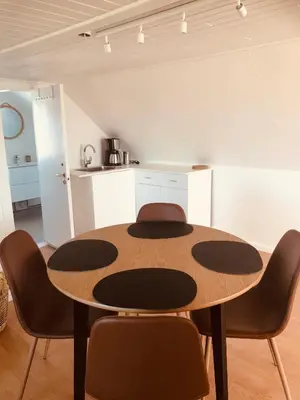a dining room with a table and chairs at Seaside Top in Thisted