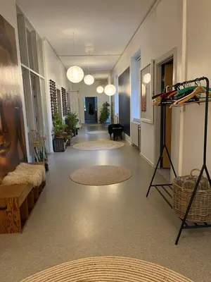 a hallway with rugs on the floor of a building at Room 5 - Hawkraft kulturhotel in Vestervig