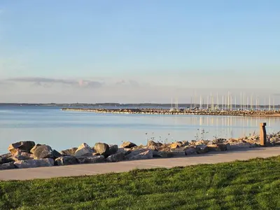 a marina with a bunch of rocks in the water at 4 person holiday home in Farsø-By Traum in Farsø
