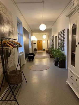a hallway of an office with a room with plants at Room 4 - Hawkraft kulturhotel in Vestervig