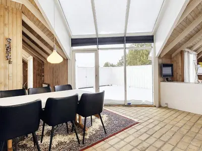 a dining room with a table and chairs at 8 person holiday home in Fjerritslev-By Traum in Fjerritslev