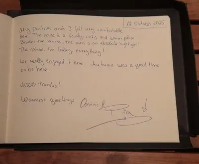 a piece of paper with a handwritten letter at Wellness Oase med Sauna, Fodbad og Højhastighed Internet i Naturens Fred og Ro in Nibe